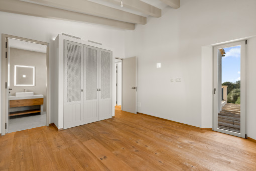 Dormitorio con baño en Suite