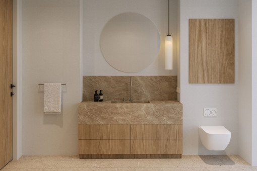 Baño en suite de alta gama con piedra natural