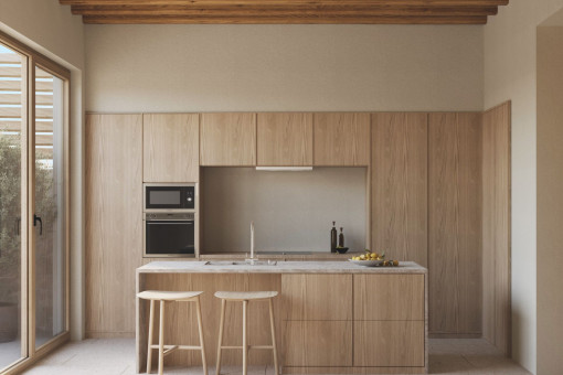Cocina luminosa de diseño con materiales naturales y acceso al patio 