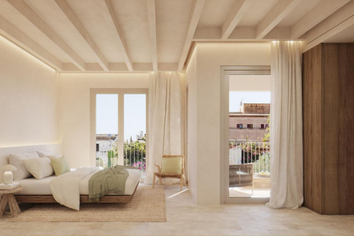 Dormitorio con baño y balcón