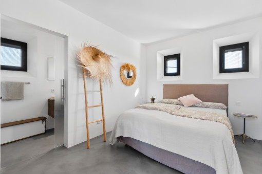 Dormitorio con baño en Suite