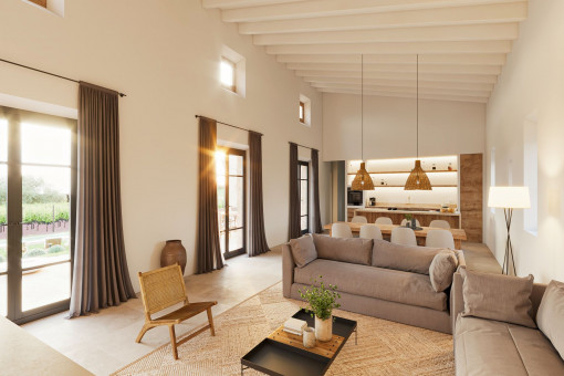 Salón con chimenea y acceso a la zona exterior